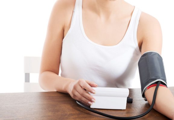 woman checking blood pressure